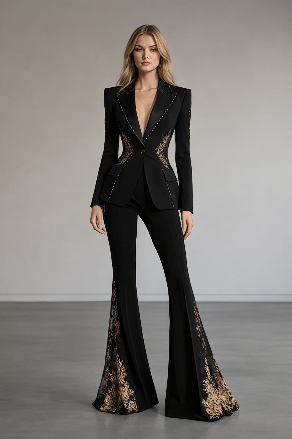 Black tailored women’s suit with gold embellished flared pants front view