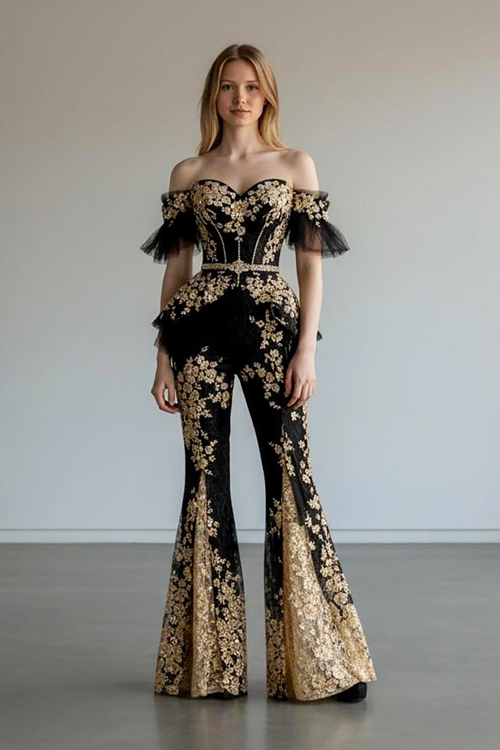 Black and gold off-shoulder corset set with flared pants front view