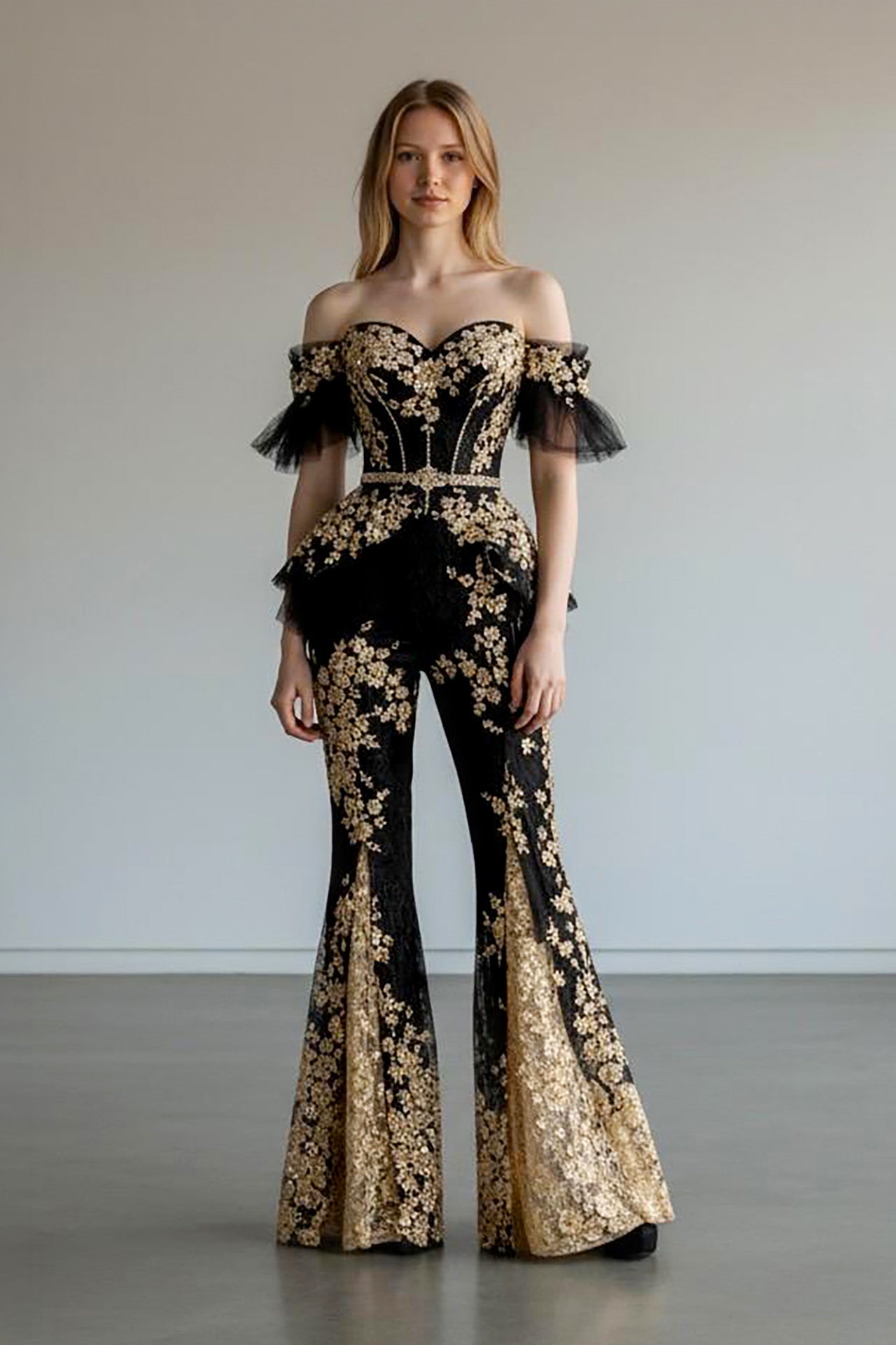 Black and gold off-shoulder corset set with flared pants front view